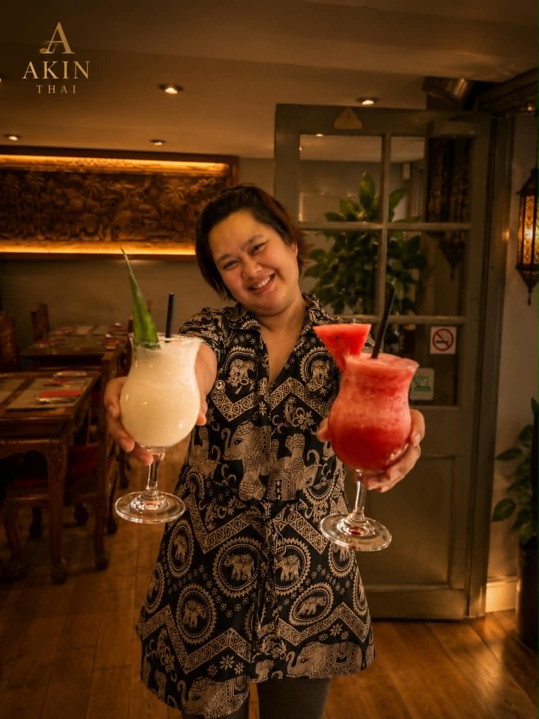 A warm Akin Thai welcome — cocktails served with a smile