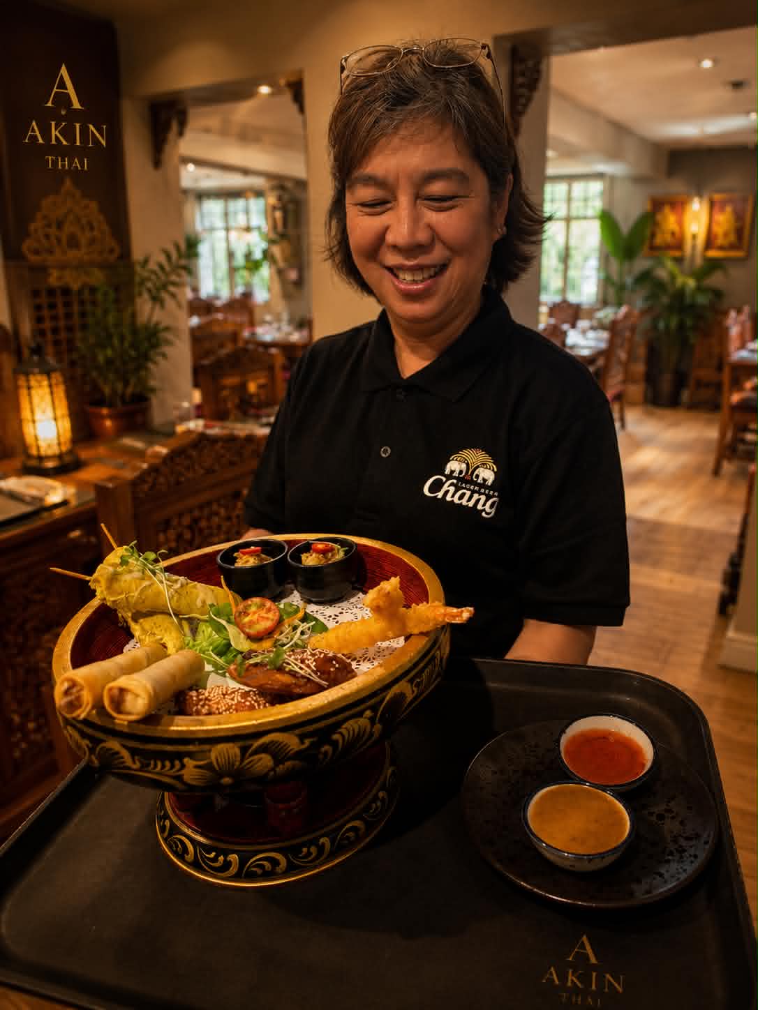 Our team serving a Thai sharing platter in the dining room
